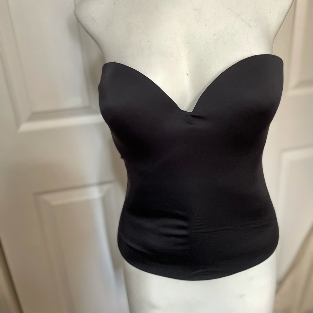 NWOT black strapless bustier with hook and eye closure.
